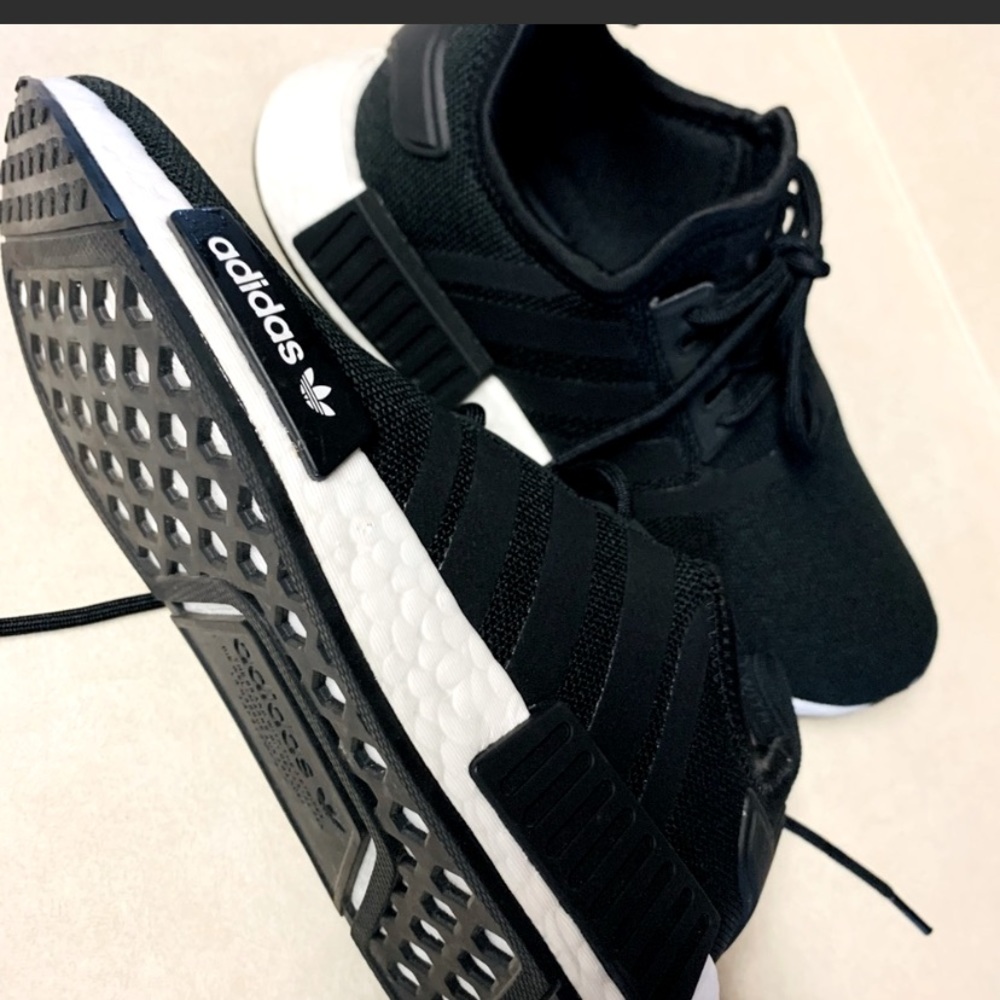 Boys Adidas NMD shoes.